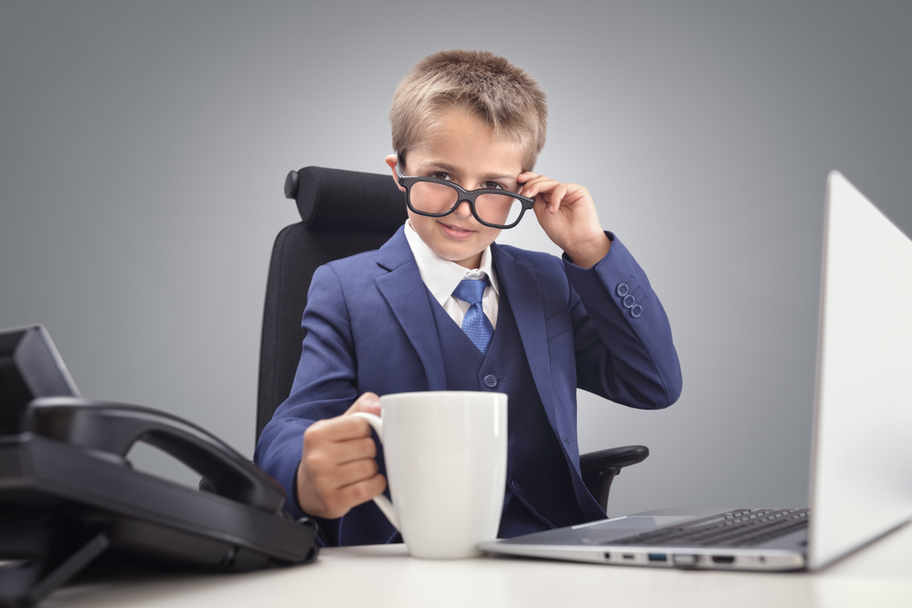 Young,Confident,Executive,Businessman,Boss,Boy,In,Office,Smiling,At